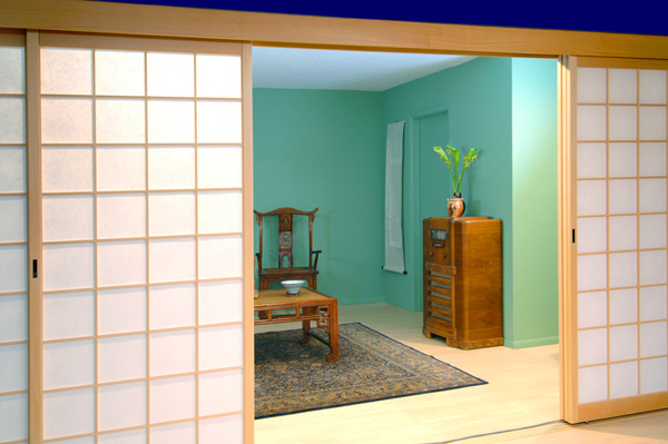 Colorful eclectic living room enclosed with shoji screens