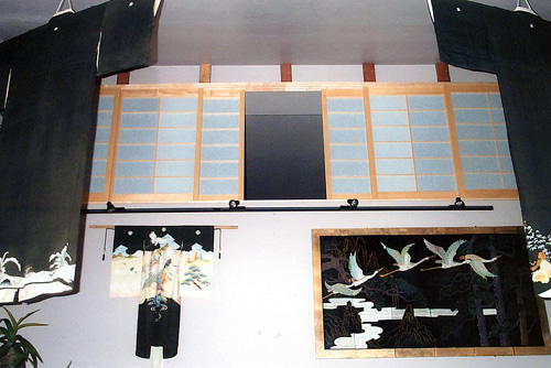 The loft shoji installed with wood tracking that has a locking mechanism so the screens can only be taken out in one position.