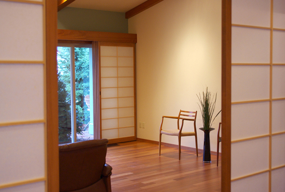 A picture of five shoji screens stacked in the corner when open.